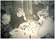  Jeroen M.W. van Dijk playing at a local church chess tournament with his back turned 